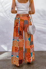 Orangefarbene Hose mit weitem Bein und Kordelzug im Boho-Patchwork-Print