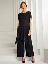 Conjunto de dos piezas de punto irregular suelto con cuello redondo en color liso