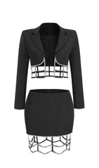 MINIVESTIDO DE LICRA CON ABERTURAS Y PIEDRA FRESA EN NEGRO