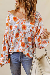 Orangefarbene Dolman-Bluse mit V-Ausschnitt und Blumenmuster