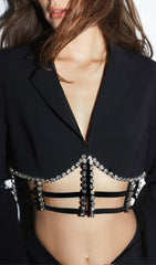 MINIVESTIDO DE LICRA CON ABERTURAS Y PIEDRA FRESA EN NEGRO