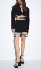 MINIVESTIDO DE LICRA CON ABERTURAS Y PIEDRA FRESA EN NEGRO