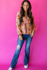 Orangefarbene Babydoll-Bluse mit Blumenmuster und quadratischem Ausschnitt und Puffärmeln