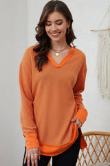 Oranges, langärmliges Oberteil mit V-Ausschnitt und Patchwork-Muster