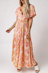 Orangefarbener Jumpsuit mit Blumenmuster, V-Ausschnitt und hoher Taille und Rüschen