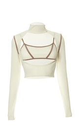 Top de tirantes con cuello alto y manga larga.