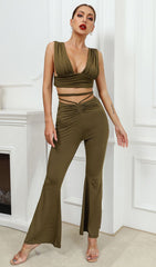 Open-back top and high-waisted bootcut trousers.