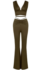 Open-back top and high-waisted bootcut trousers.