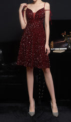 VESTIDO MIDI CON LENTEJUELAS Y ESCOTE PROFUNDO