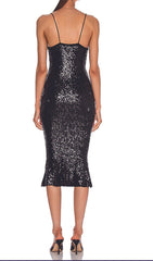 Schwarzes Kleid mit Strumpfhalterstern und Diamanten