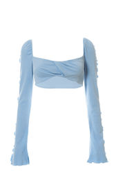 Tube-Top und langärmlige Weste.