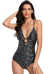 Einteilige Bademode mit Sommerflecken