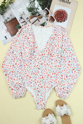 Bodysuit mit tiefem V-Ausschnitt und Blumenmuster