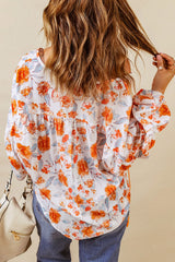 Orangefarbene Dolman-Bluse mit V-Ausschnitt und Blumenmuster