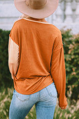 Top Henley de manga larga con bloques de color y rayas naranjas