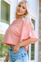 Rosa Waffelstrickbluse mit Rüschen und halblangen Ärmeln