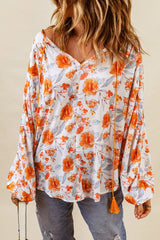 Orangefarbene Dolman-Bluse mit V-Ausschnitt und Blumenmuster