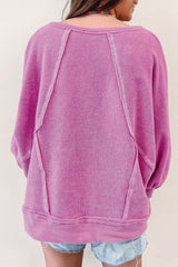 Jersey de rizo rosa con cuello redondo y costuras expuestas