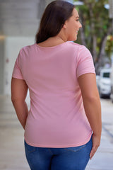 Camiseta rosa con abertura frontal y escote Peekaboo de talla grande
