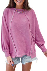 Jersey de rizo rosa con cuello redondo y costuras expuestas