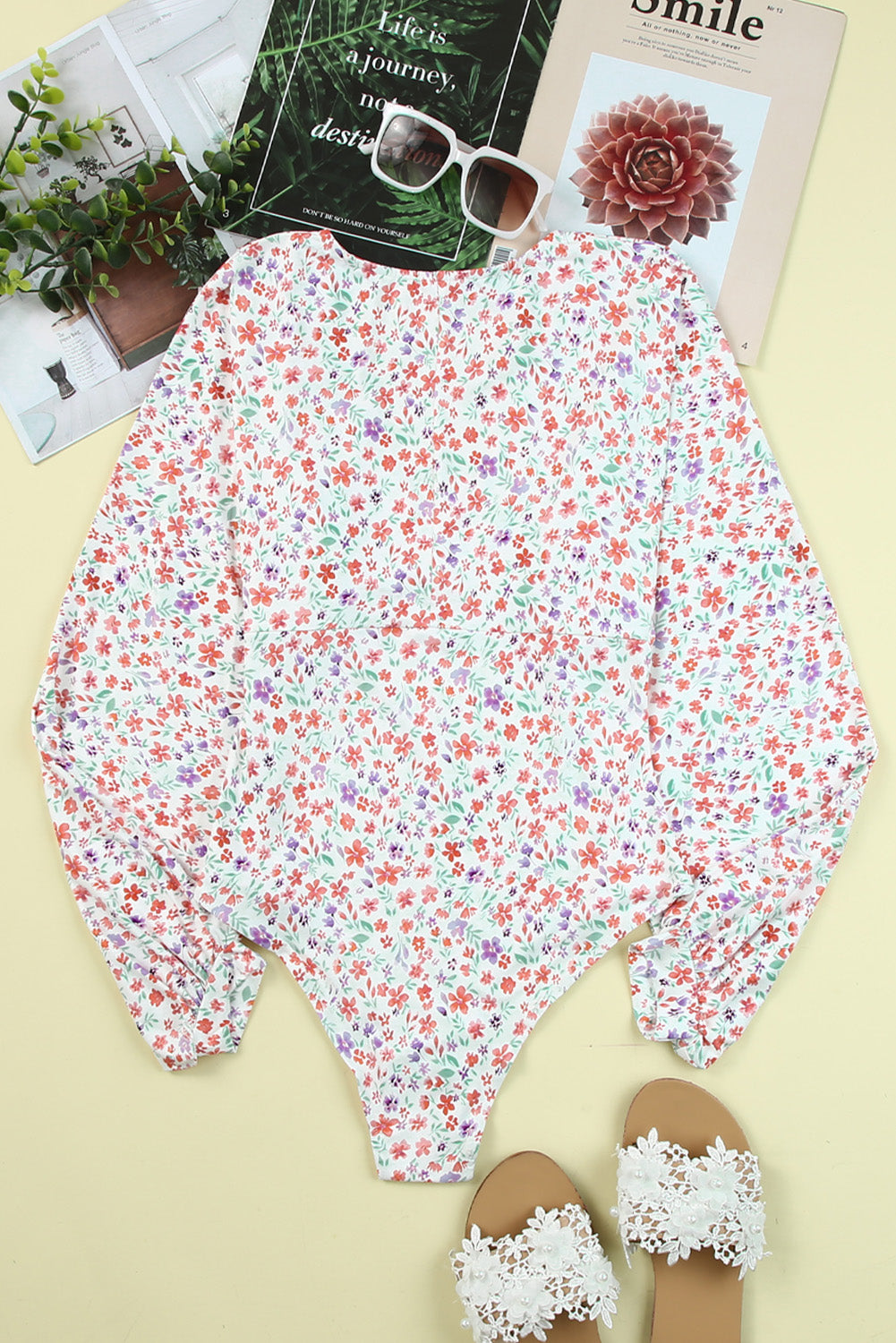 Plunging V Neck Floral Bodysuit