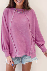 Jersey de rizo rosa con cuello redondo y costuras expuestas